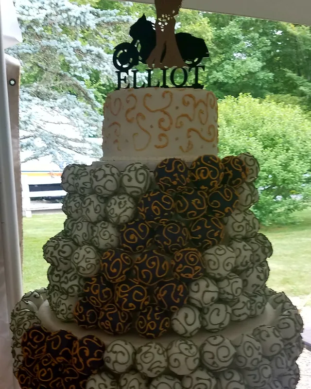 Wedding cake covered in brown and gold sugar rosettes